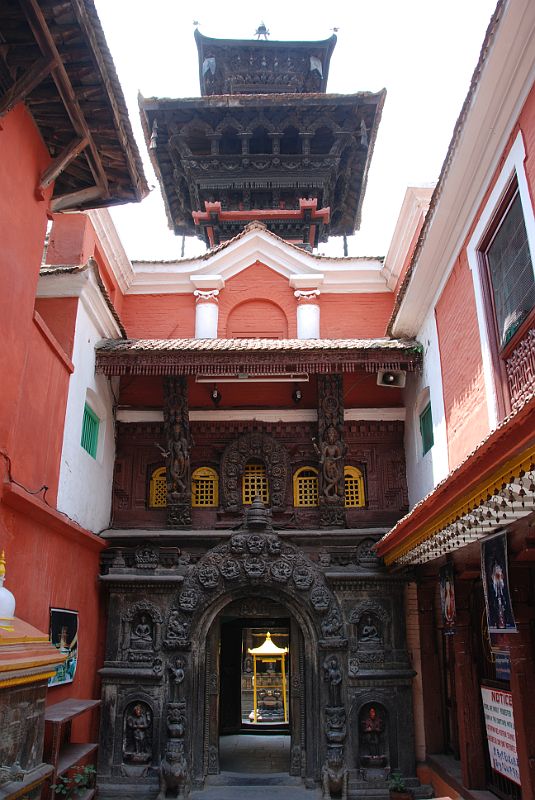 Kathmandu Patan Golden Temple 01 Entrance Towards Inner Courtyard The Golden Temple is a Buddhist monastery just north of Durbar Square in Patan built somewhere between 12C and 15C. The Golden temple is also known as Hiranya Varna Mahavihara or Kwa Bahal. The entry to the courtyard of the Golden Temple in Patan has many ornately carved many-armed deities flanked by a pair of griffins.